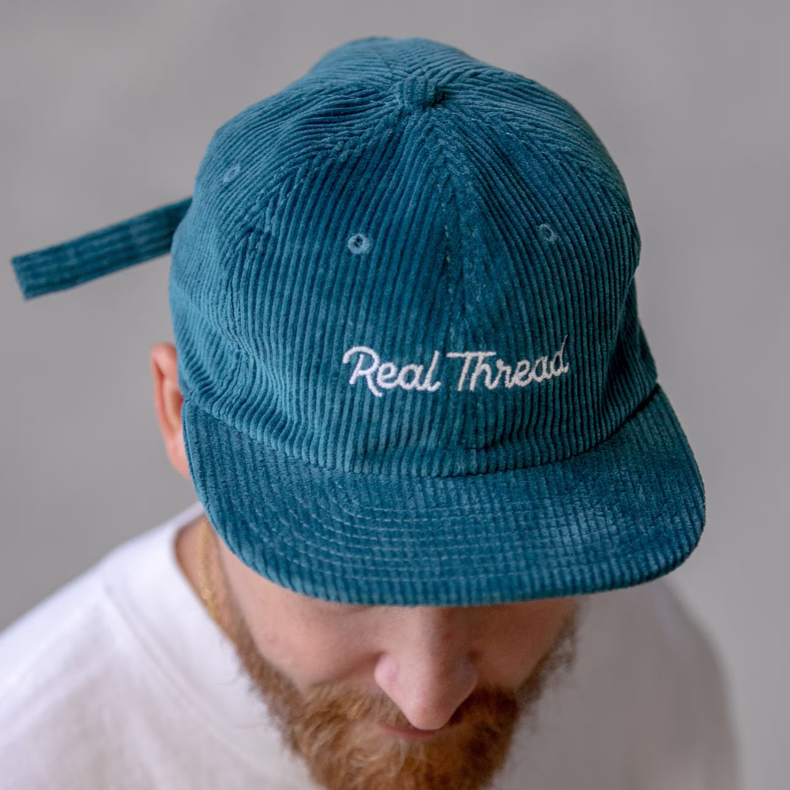 man wearing a blue hat